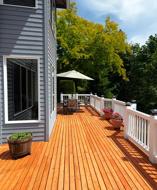 A cedar deck with white railings