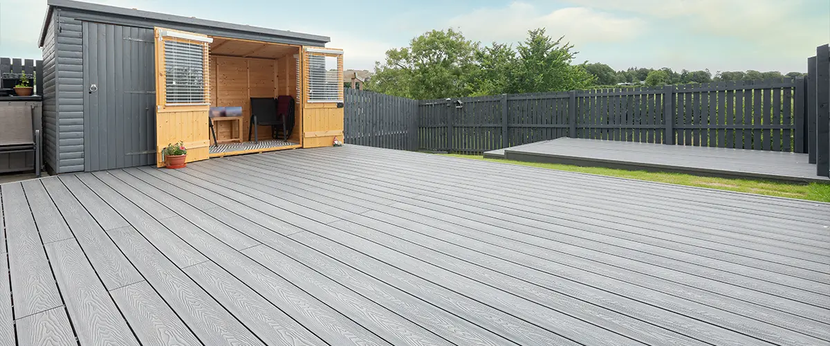 Gray composite decking with shed