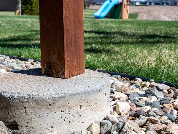 A deck post and concrete deck footing