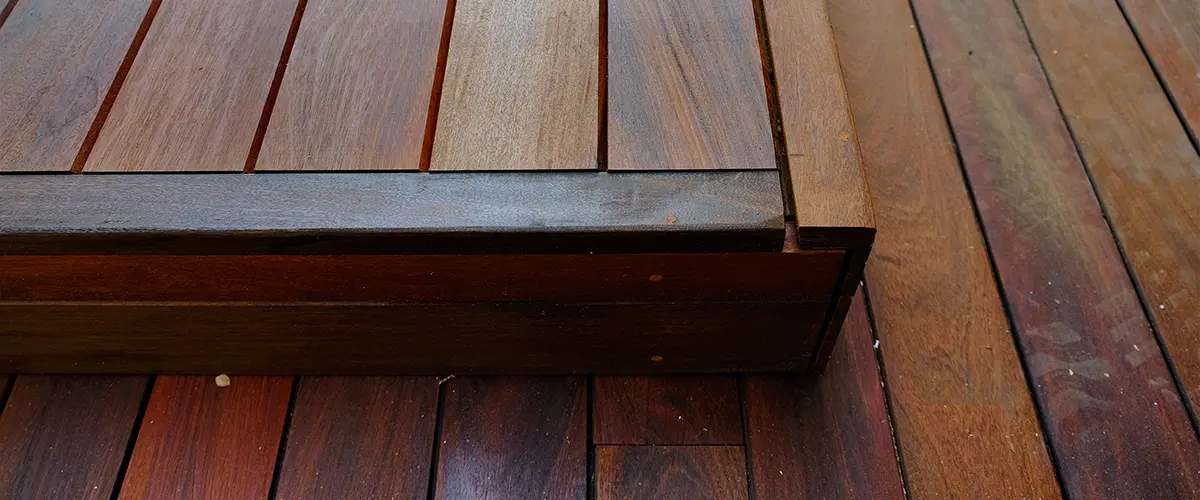 Hardwood decking material with a step