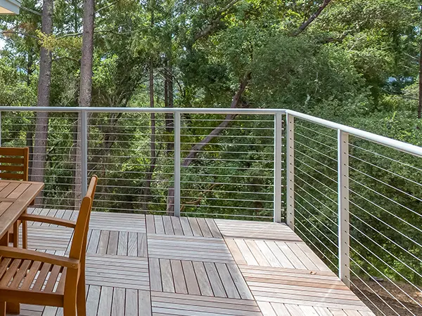 An elevated deck with steel railing