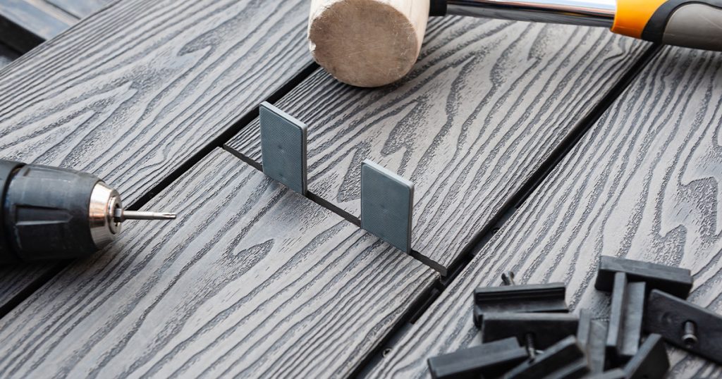 Composite decking with wood mallet and fasteners
