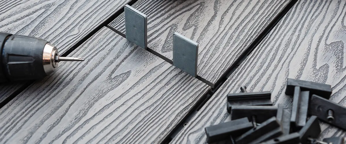 Black composite decking with fasteners