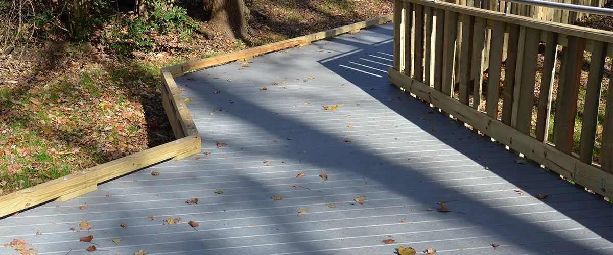 Composite decking with wood railing