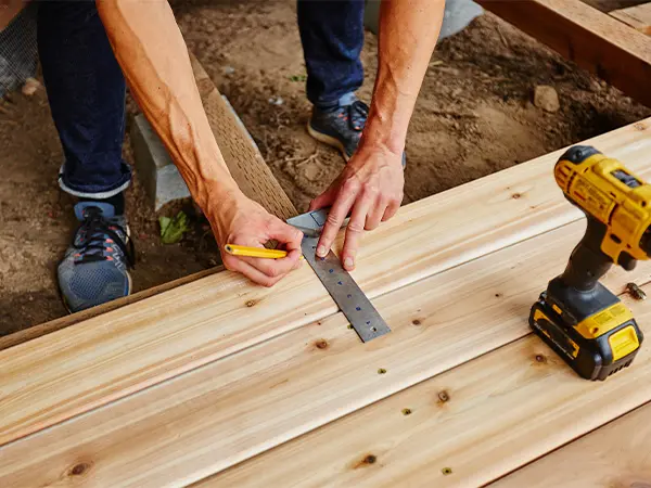 deck builder installing wood decking