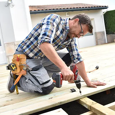 A deck builder installing a deck