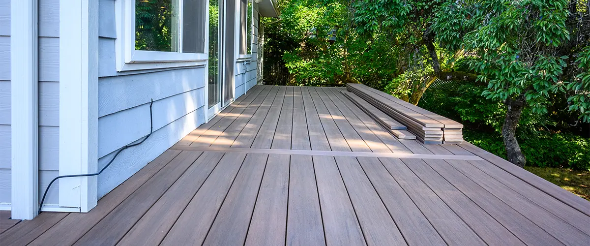 PVC decking with a light blue home siding