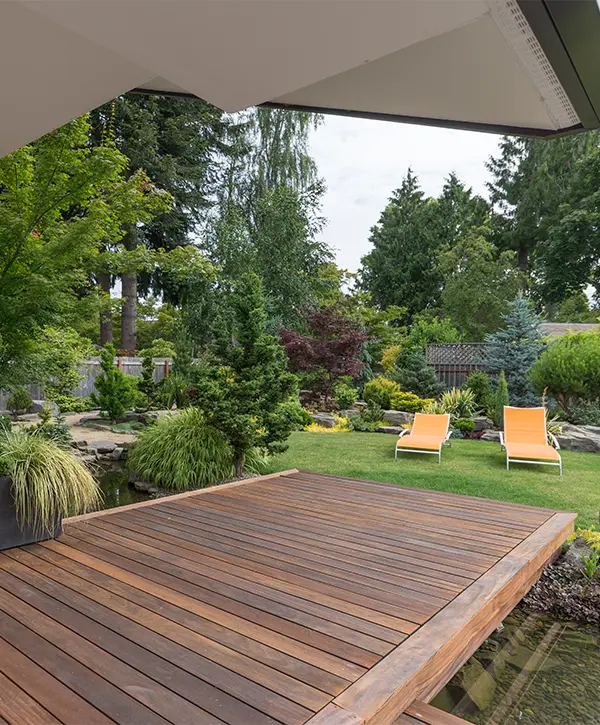 Hardwood decking near pond in backyard