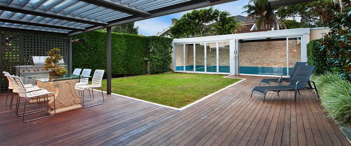 Ground decking with wood and long chairs