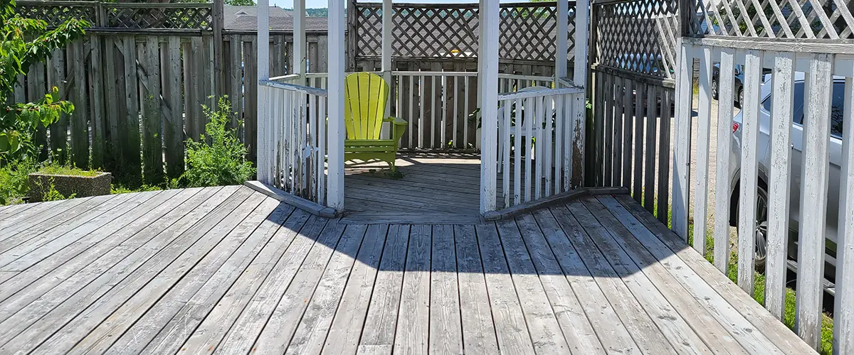 Dated wooden deck with a gazebo