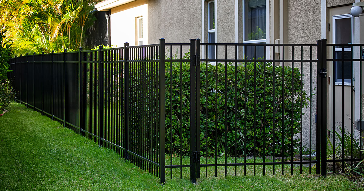 Aluminum fence on a patch of grass
