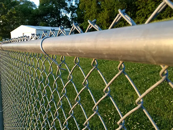 A chain link fence with metal posts