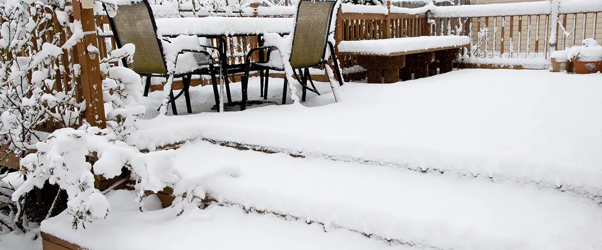 A wood deck full of snow