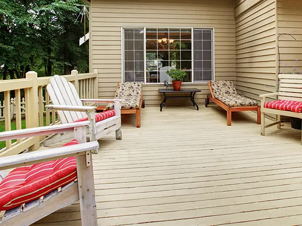 Beige wood decking with outdoor furniture