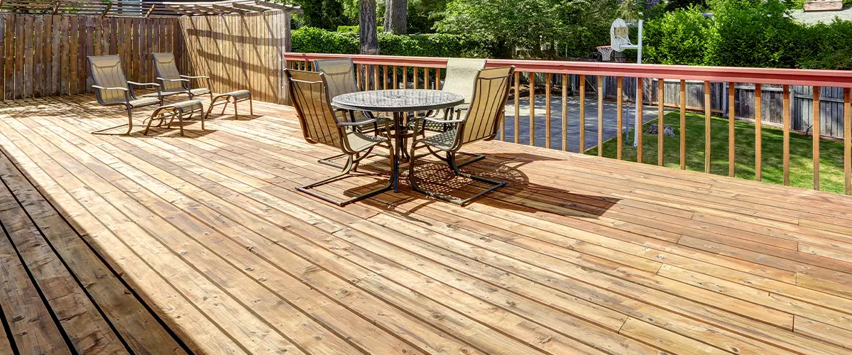 Wood decks with wood railing and outdoor furniture