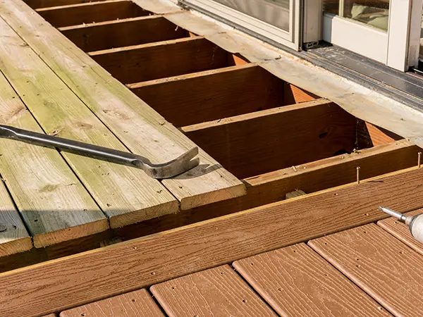 Pressure-treated wood replacement with composite decking