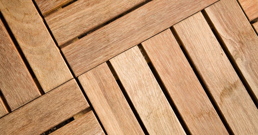Wooden deck tile for an outdoor space