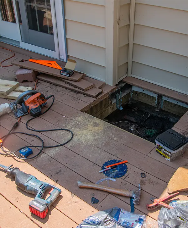 A deck repair cost in Bothell with tools spread over decking surface