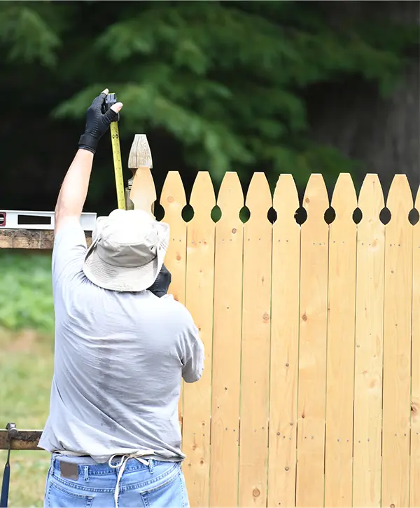 A worker from one of the best fence installation companies in North Creek