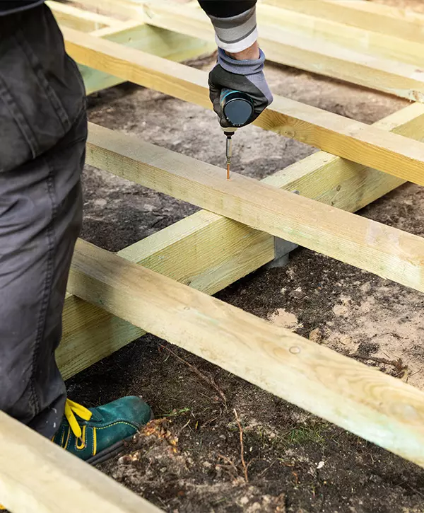 construction worker building wooden frame for terrace deck Maltby, WA