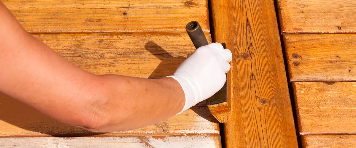 Wooden deck painting apply stain on decking